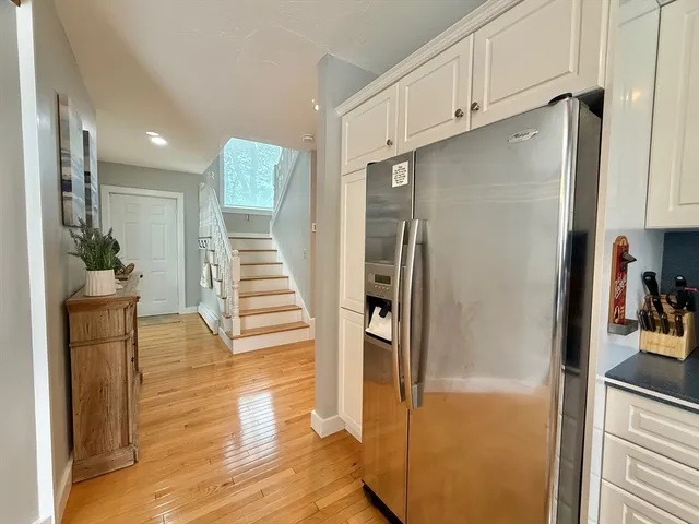 a view of a kitchen from the hallway