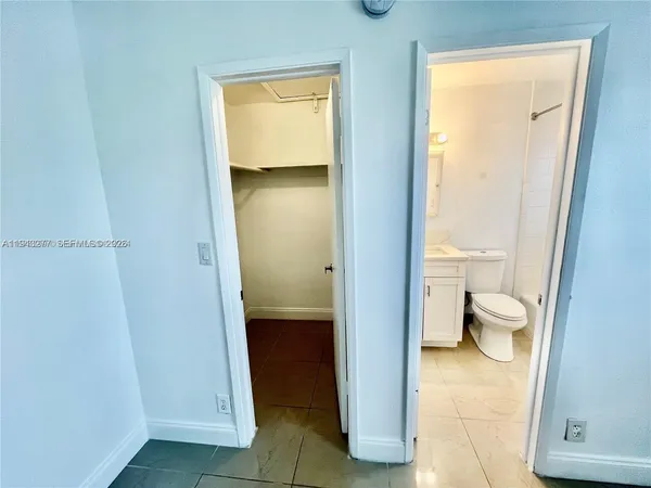 a kitchen with a refrigerator stove and microwave