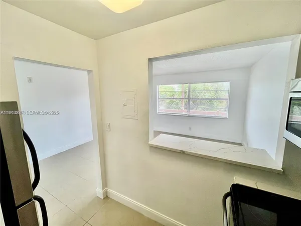 a kitchen with stainless steel appliances a refrigerator and a stove top oven