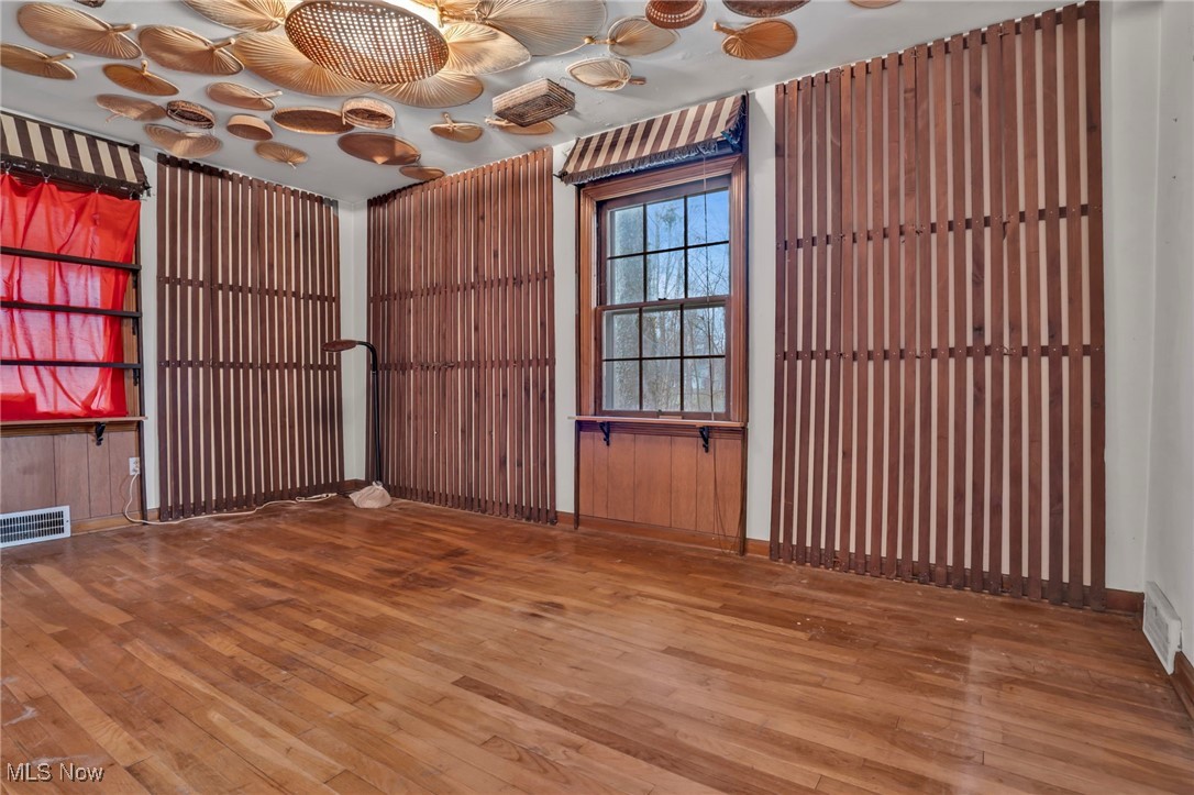 4468 Fishcreek Road Stow, OH 44224 - Photo 13 of 38 Empty room with visible vents and wood finished floors