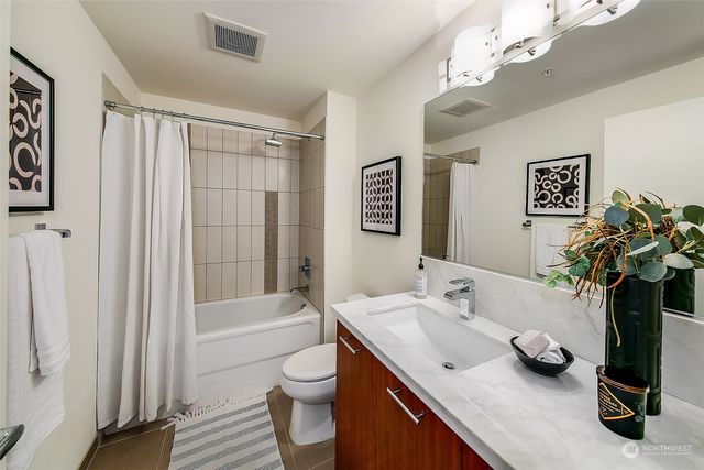 a view of a storage & utility room with washer and dryer