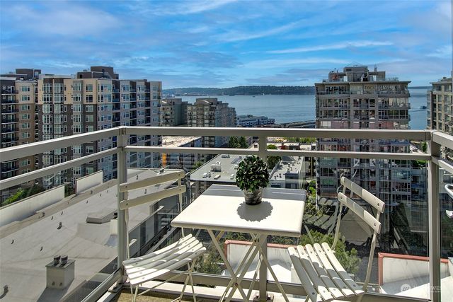 a view of a balcony with two chairs and a table