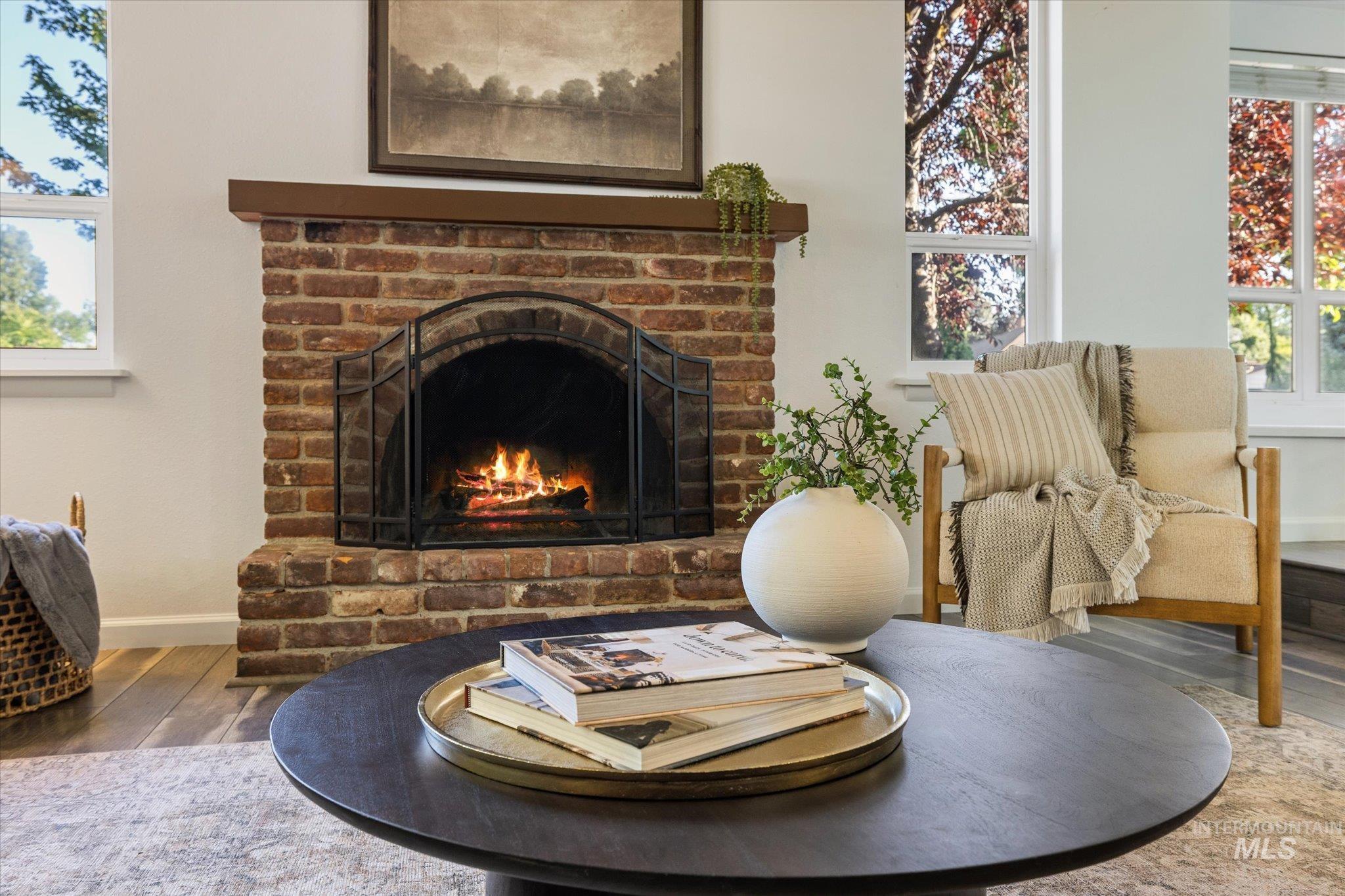 2302 Pendleton Street Boise, ID 83705 - Photo 6 of 35 Brick fireplace with a dark wood mantel and metal screen