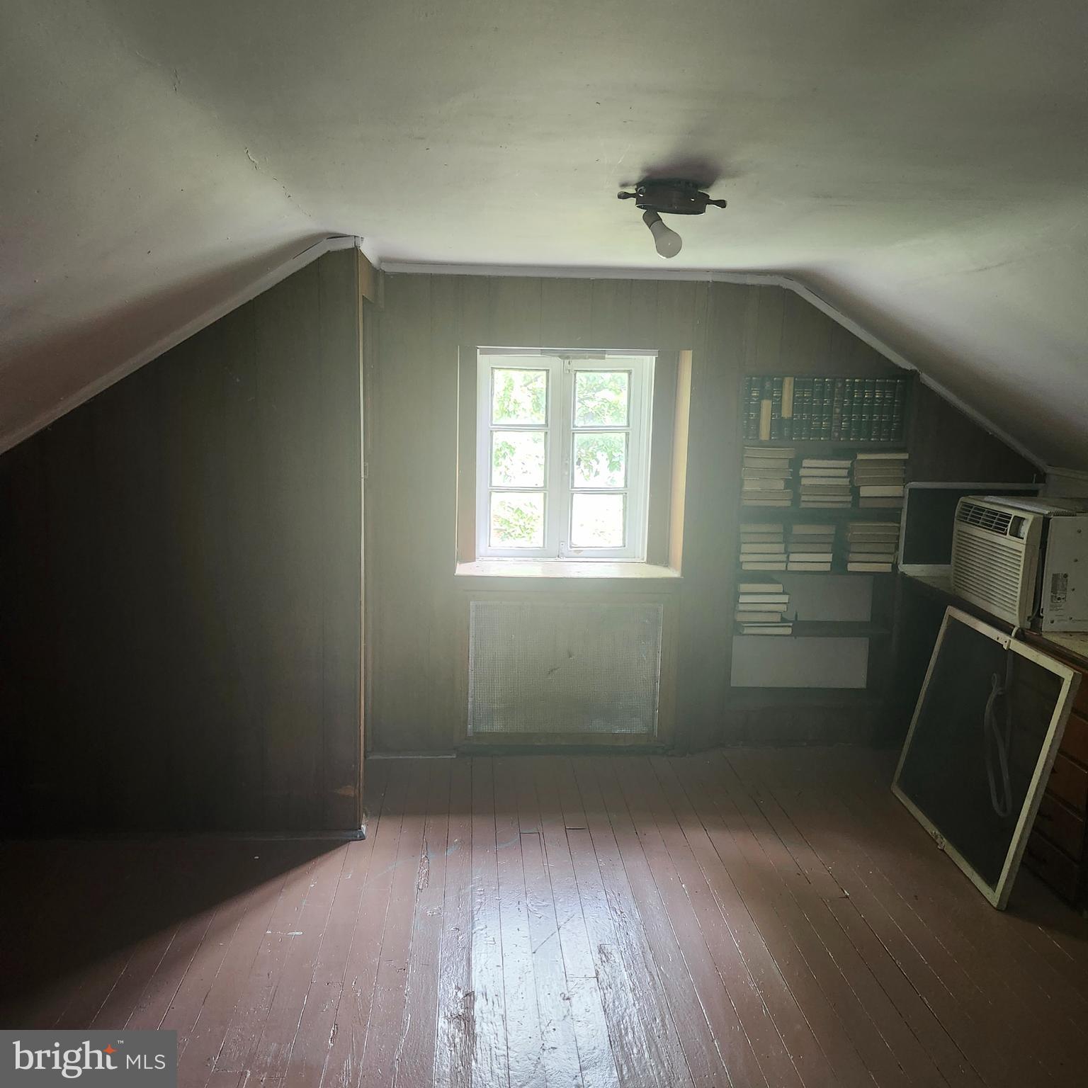 905 Cooks Lane Baltimore, MD 21229 - Photo 17 of 20 wooden floor in an empty room with a window