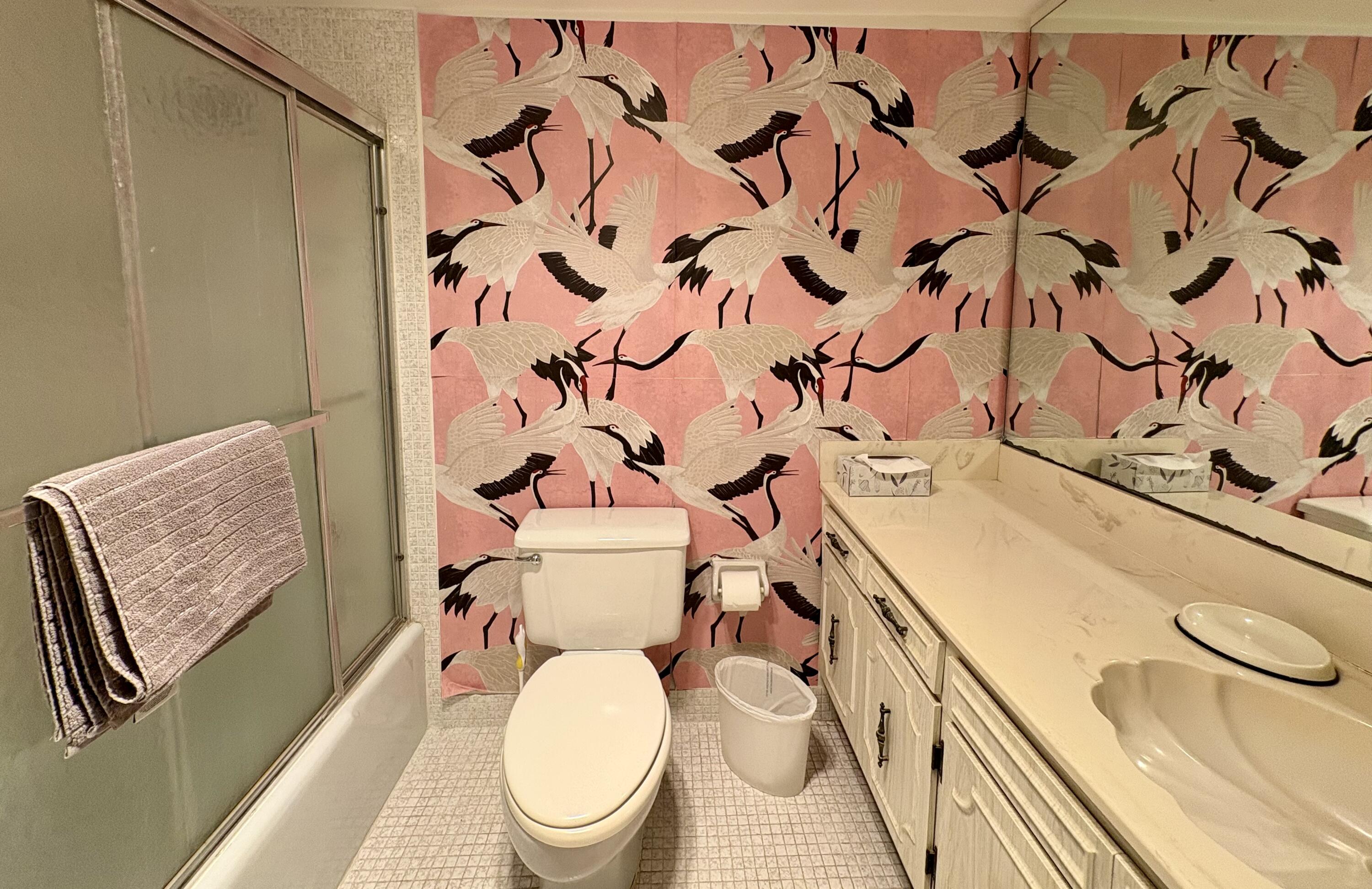 3150 North Course Lane, Unit 202 Pompano Beach, FL 33069 - Photo 15 of 18 a white toilet sitting next to a shower curtain