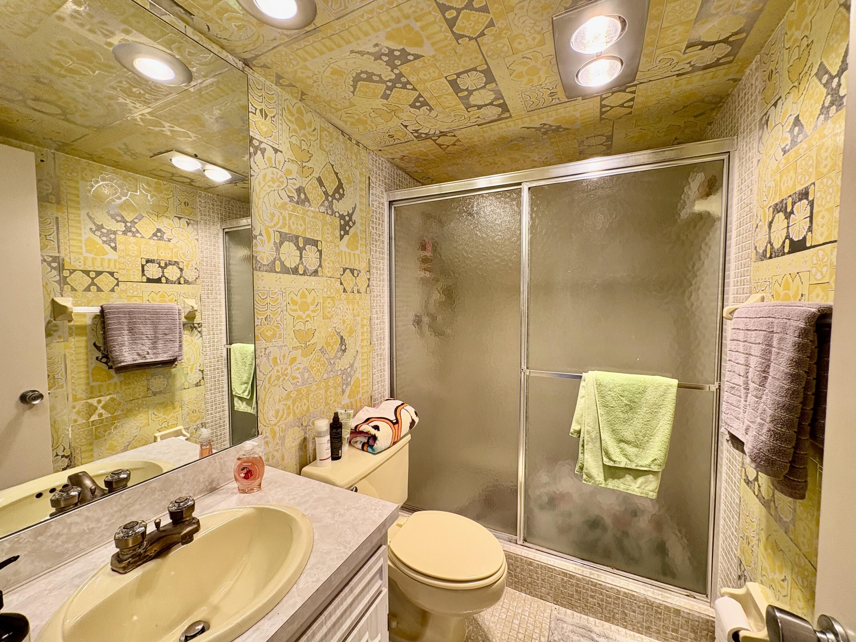 3150 North Course Lane, Unit 202 Pompano Beach, FL 33069 - Photo 16 of 18 a bathroom with a sink toilet and shower