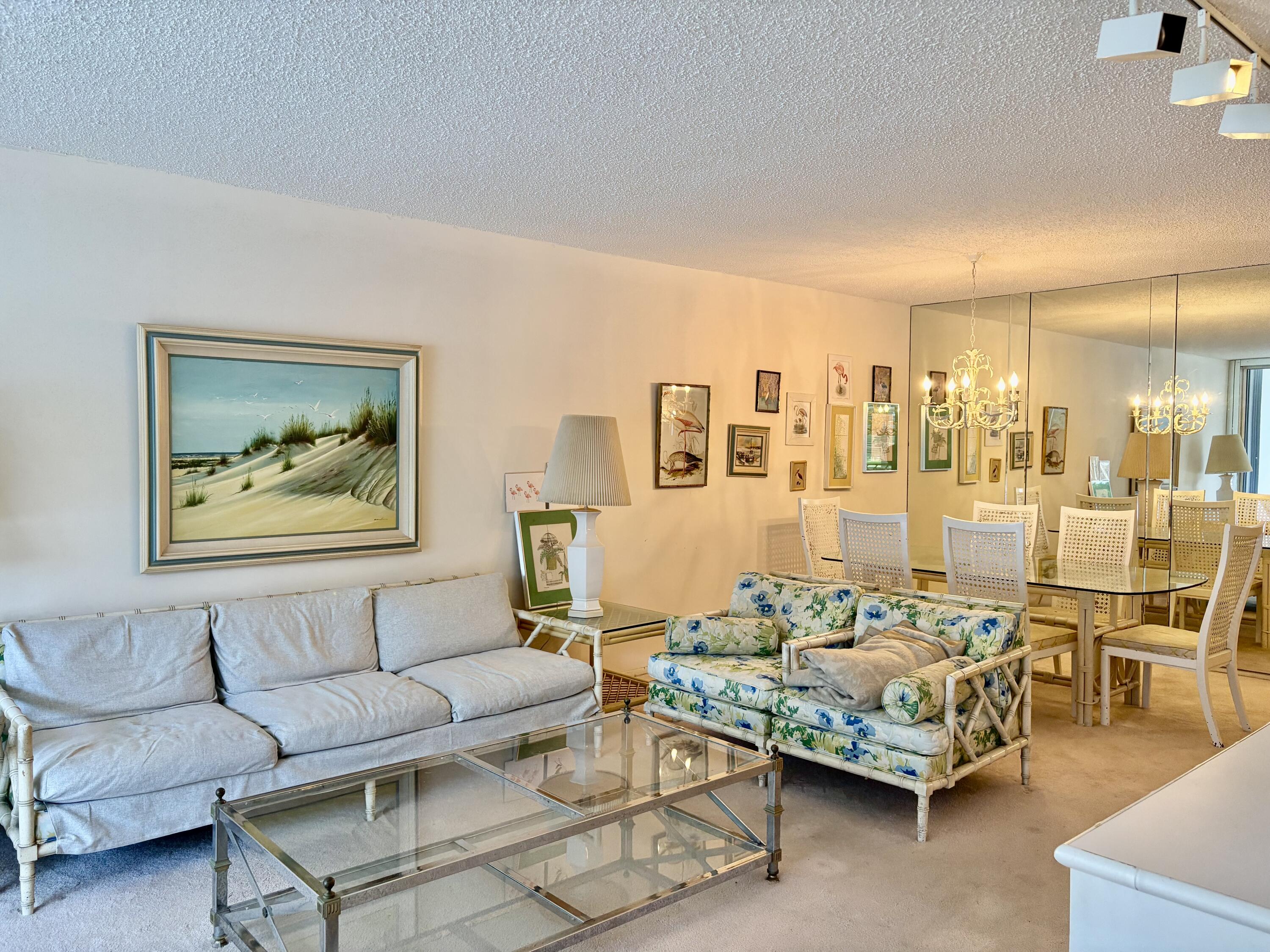3150 North Course Lane, Unit 202 Pompano Beach, FL 33069 - Photo 3 of 18 a living room with furniture and a glass door