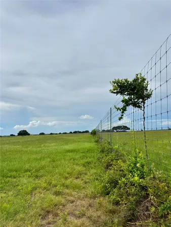 a view of a big yard with a house