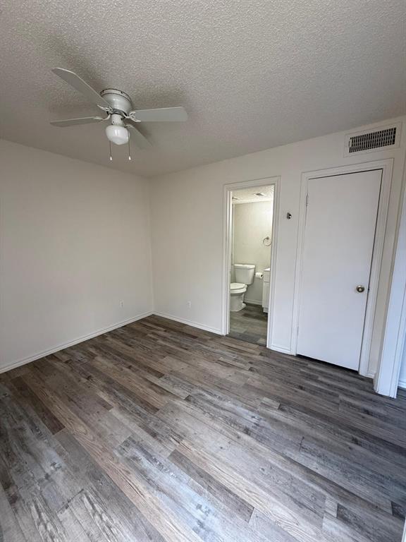 9807 Walnut Street, Unit D 304 Dallas, TX 75243 - Photo 2 of 7 a view of empty room with wooden floor
