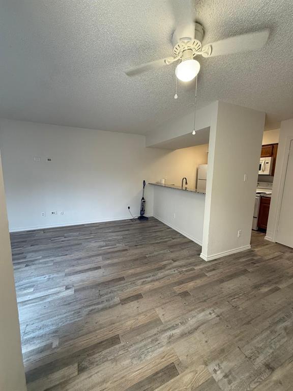 9807 Walnut Street, Unit D 304 Dallas, TX 75243 - Photo 4 of 7 wooden floor in an empty room with a window