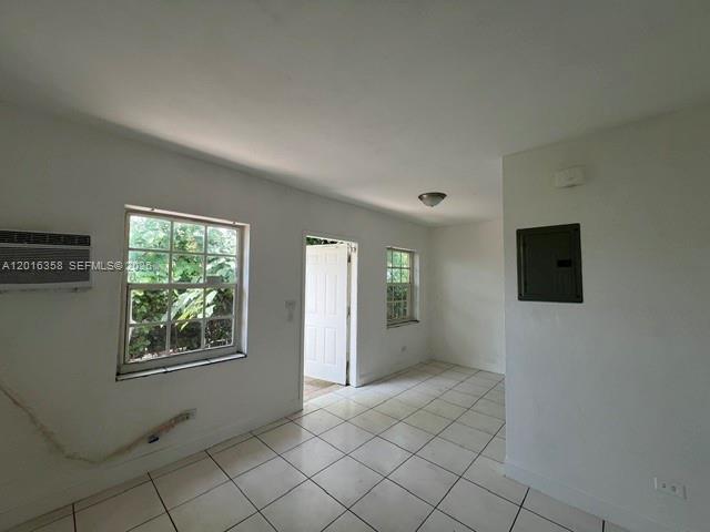 441 Southwest 10th Street, Unit 4 Miami, FL 33130 - Photo 9 of 18 a view of an empty room with window and cabinet