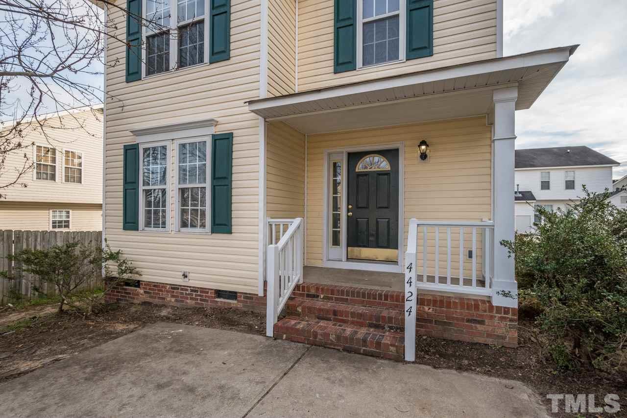 4424 Windstorm Way Raleigh, NC 27616 - Photo 2 of 14 a front view of a house with a garden