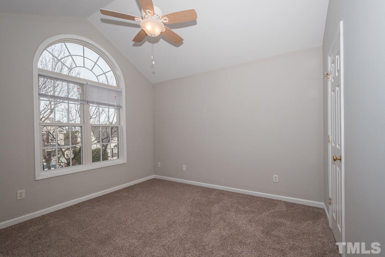 4424 Windstorm Way Raleigh, NC 27616 - Photo 11 of 14 an empty room with a view of front door