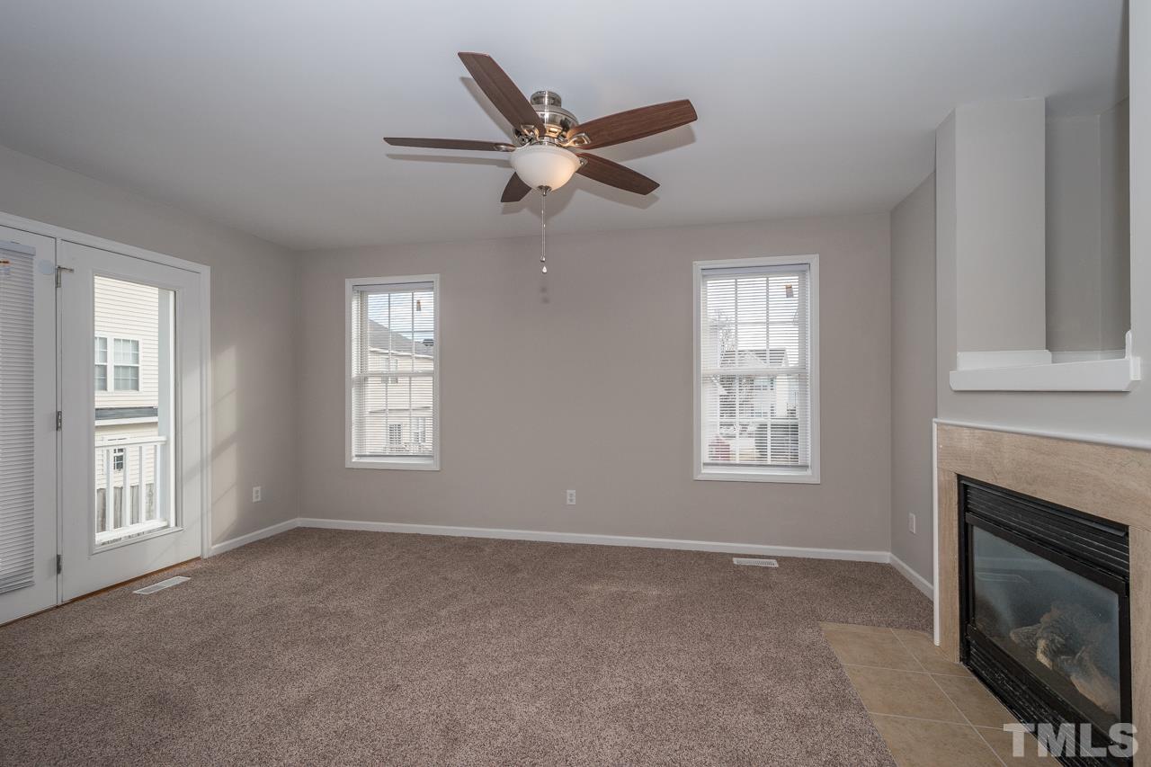 4424 Windstorm Way Raleigh, NC 27616 - Photo 10 of 14 a view of a livingroom with a ceiling fan and window