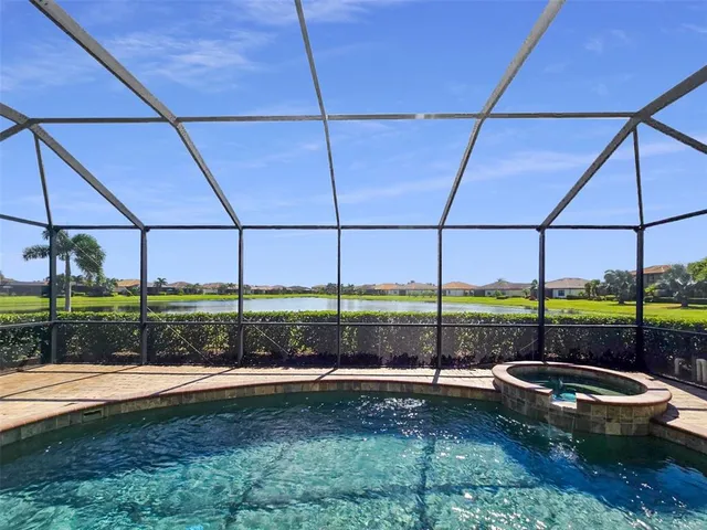 a view of a backyard with sitting area