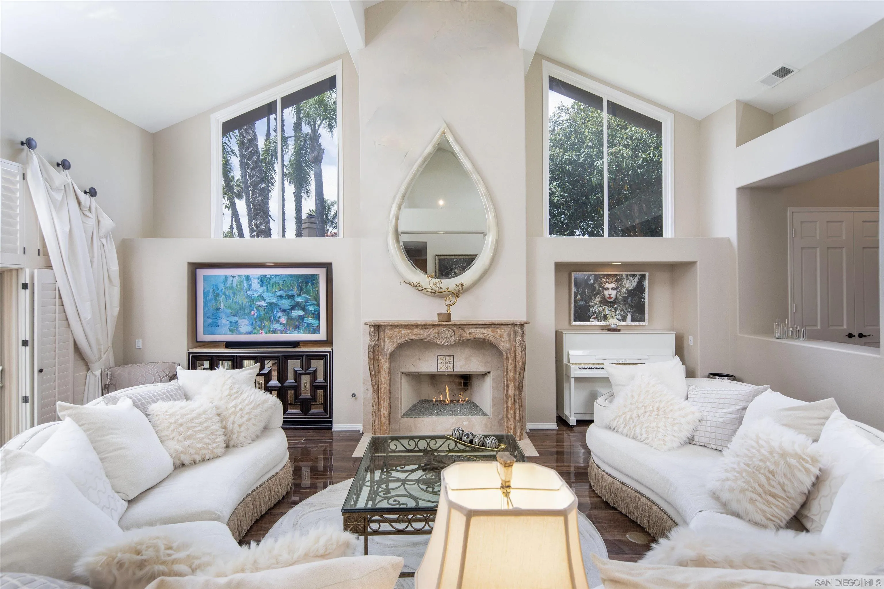 15448 Pimlico Corte Rancho Santa Fe, CA 92067 - Photo 11 of 31 a living room with furniture a fireplace and a large window