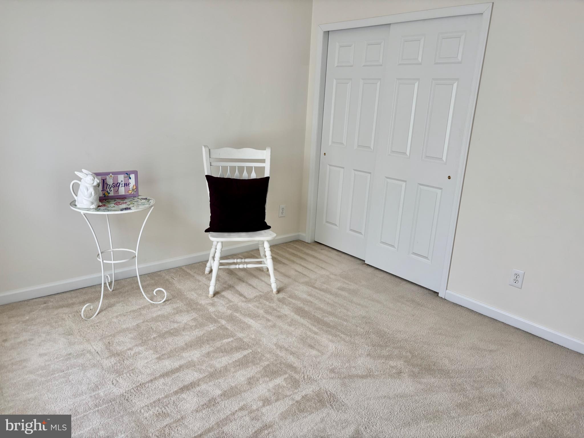 165 Einstein Way Cranbury, NJ 08512 - Photo 27 of 37 a living room with furniture a rug and a chair