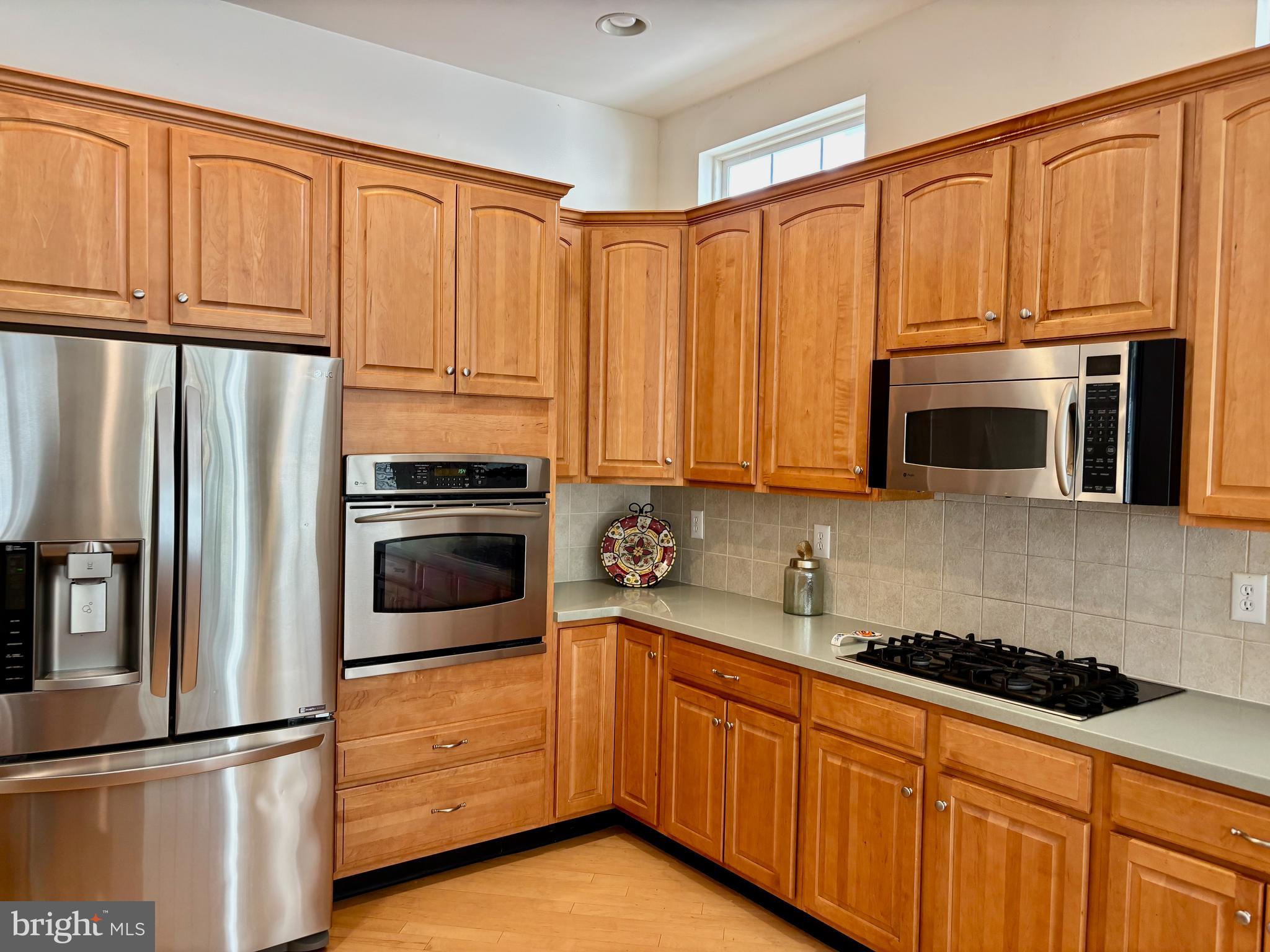 165 Einstein Way Cranbury, NJ 08512 - Photo 5 of 37 a kitchen with stainless steel appliances granite countertop a refrigerator sink and microwave