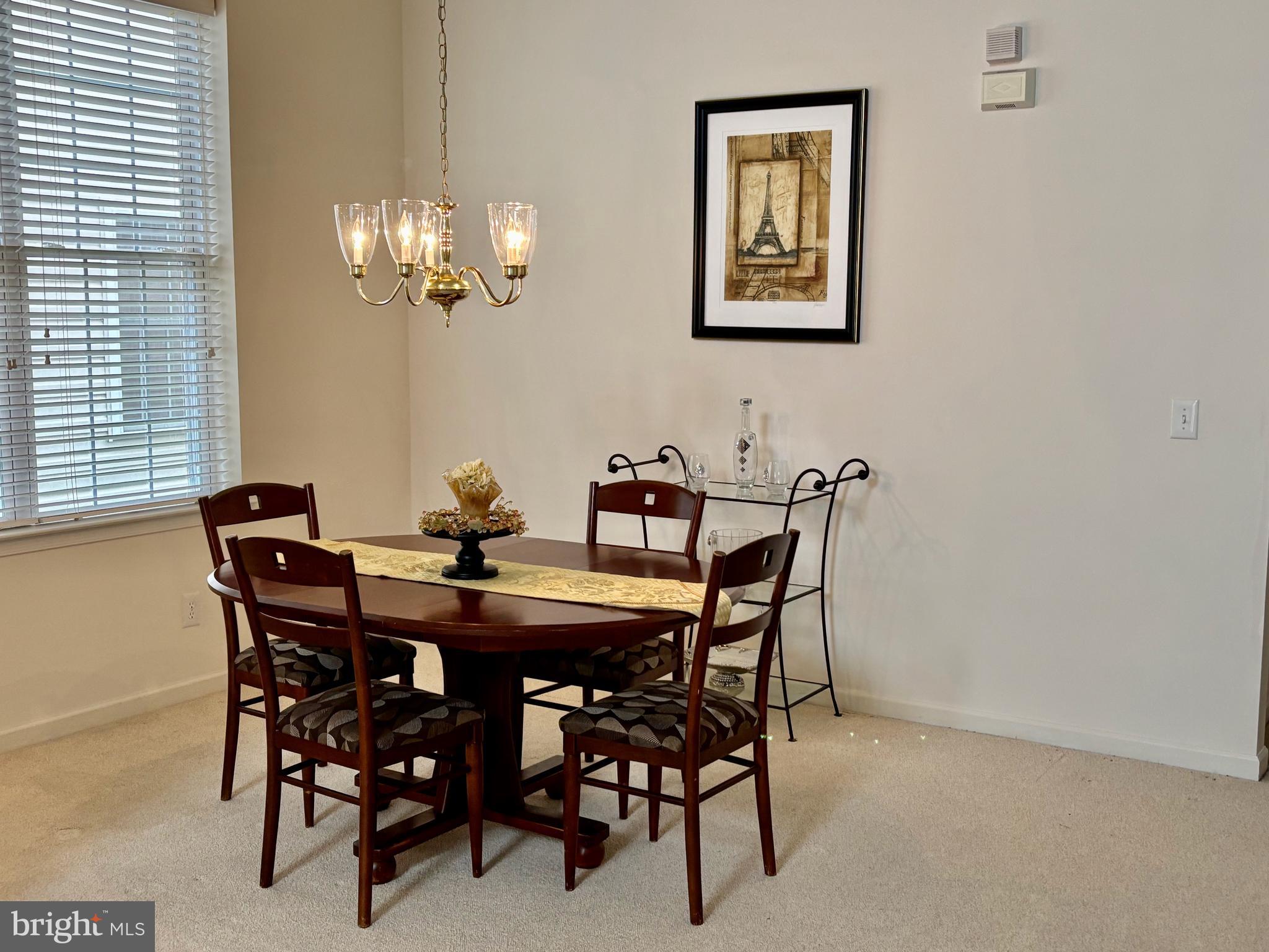 165 Einstein Way Cranbury, NJ 08512 - Photo 9 of 37 a view of a dining room with furniture and chandelier