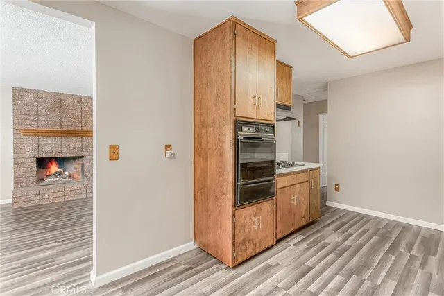 a kitchen with stainless steel appliances a refrigerator and a stove