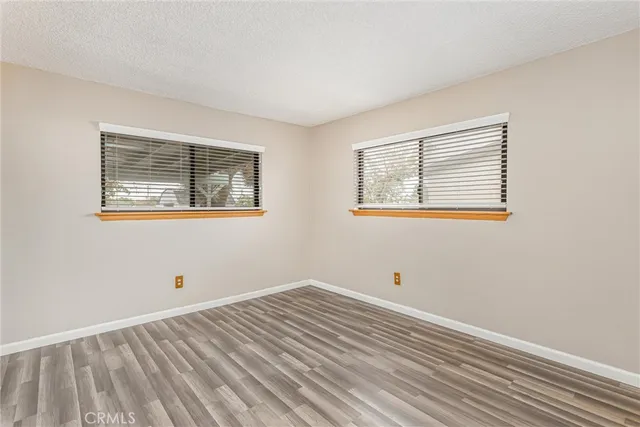 a view of room with wooden floor and window