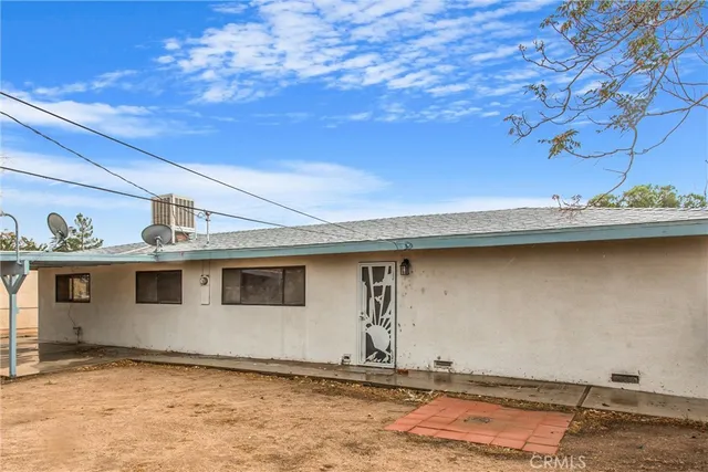 a front view of a house with trees