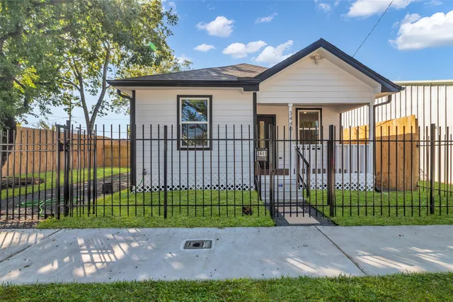 a view of a backyard with a small garden