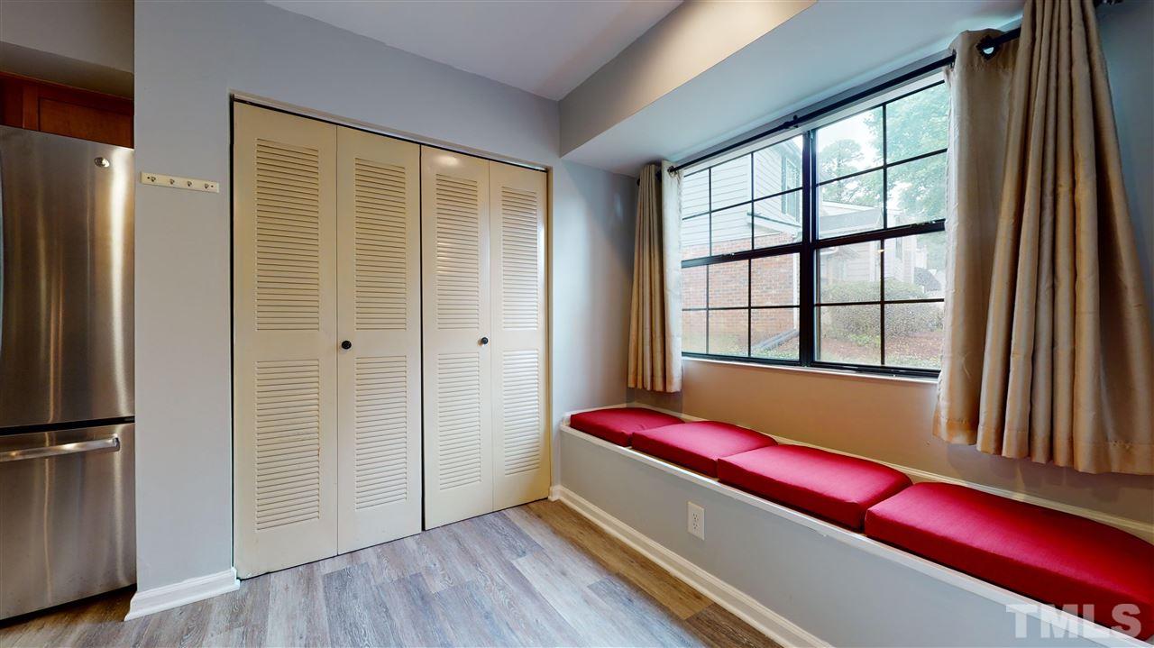 2453 Condor Court, Unit 2453 Raleigh, NC 27615 - Photo 13 of 26 a room with window and wooden floor