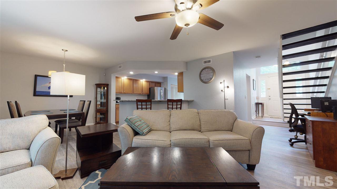 2453 Condor Court, Unit 2453 Raleigh, NC 27615 - Photo 3 of 26 a living room with furniture and wooden floor