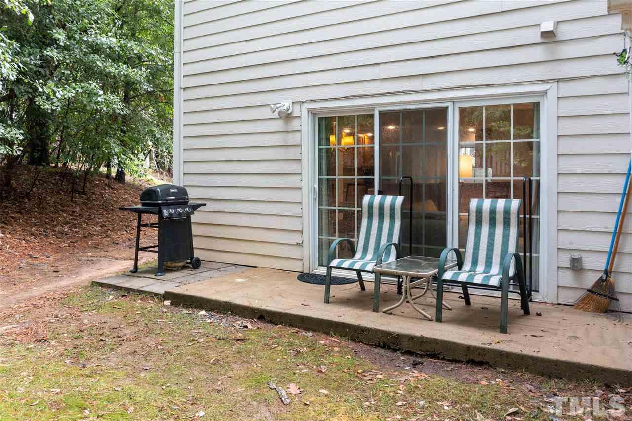 2453 Condor Court, Unit 2453 Raleigh, NC 27615 - Photo 21 of 26 a view of a house with backyard and porch