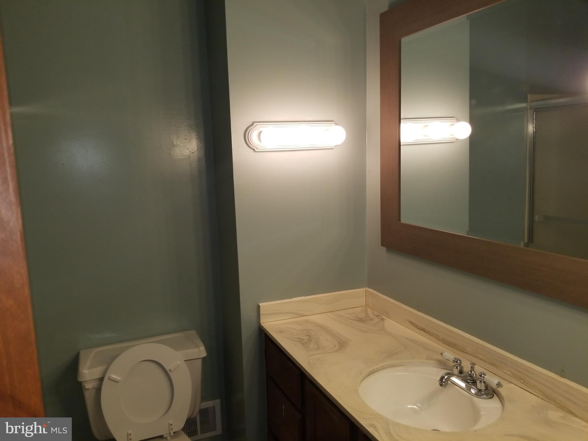 2708 Rambler Place Adelphi, MD 20783 - Photo 13 of 41 a bathroom with a granite countertop sink and a mirror