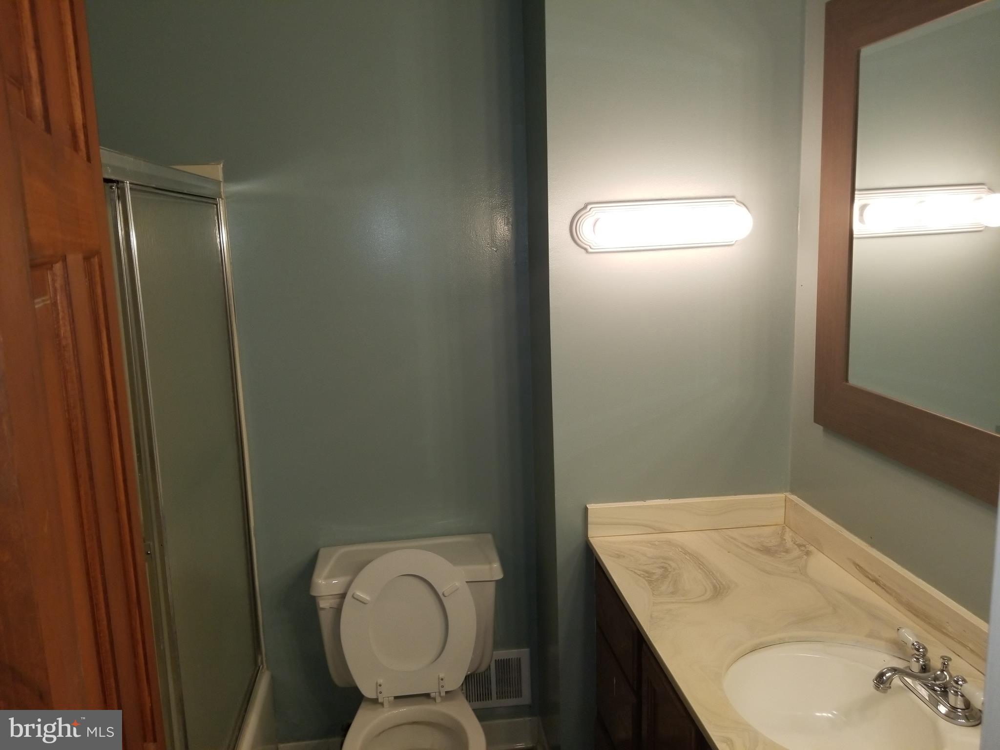 2708 Rambler Place Adelphi, MD 20783 - Photo 14 of 41 a bathroom with a granite countertop sink mirror vanity and toilet