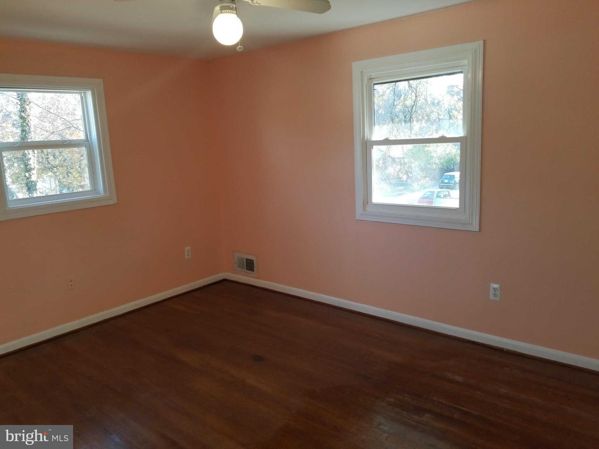 2708 Rambler Place Adelphi, MD 20783 - Photo 15 of 41 an empty room with wooden floor and windows