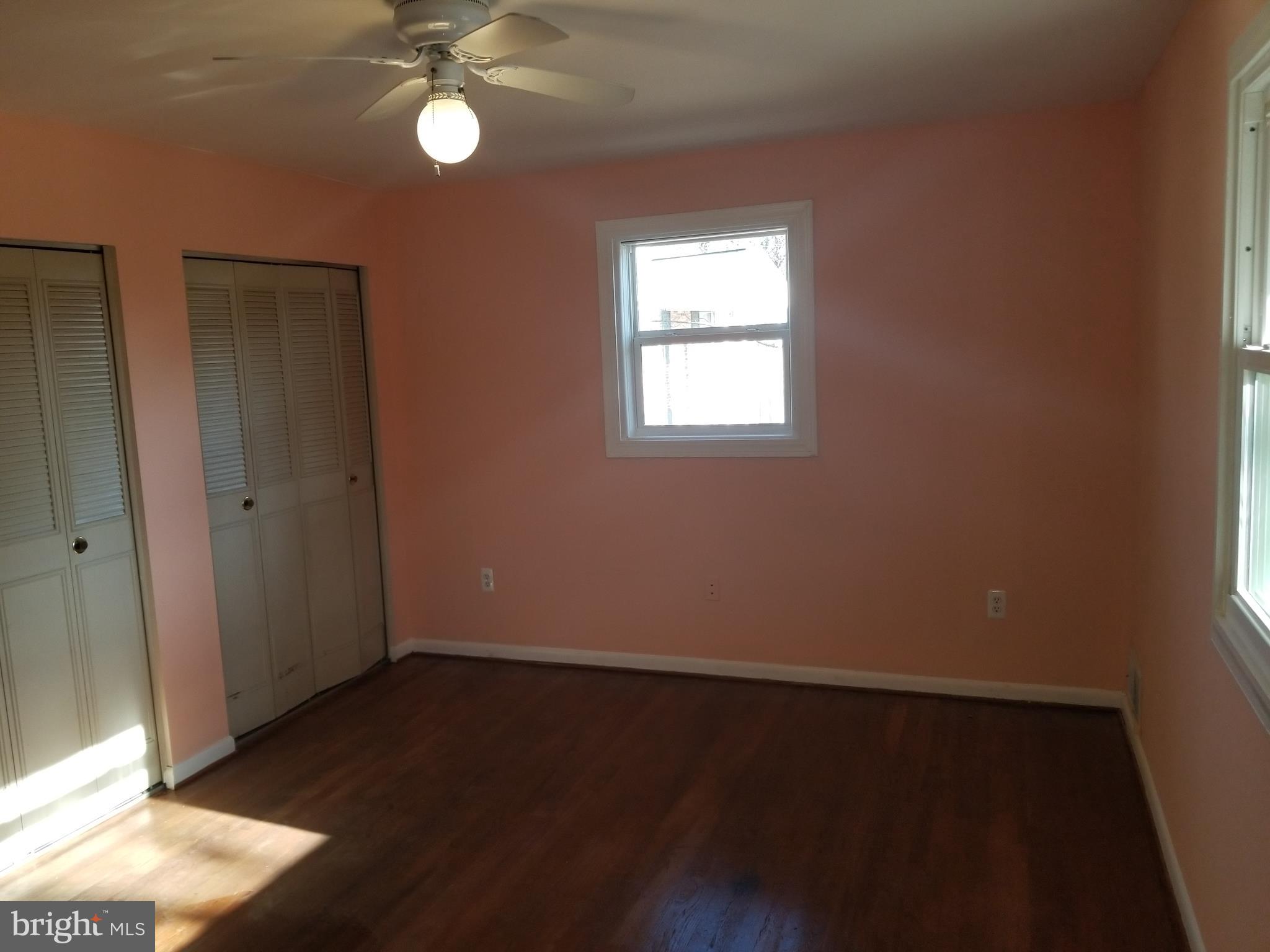 2708 Rambler Place Adelphi, MD 20783 - Photo 16 of 41 an empty room with wooden floor closet and windows