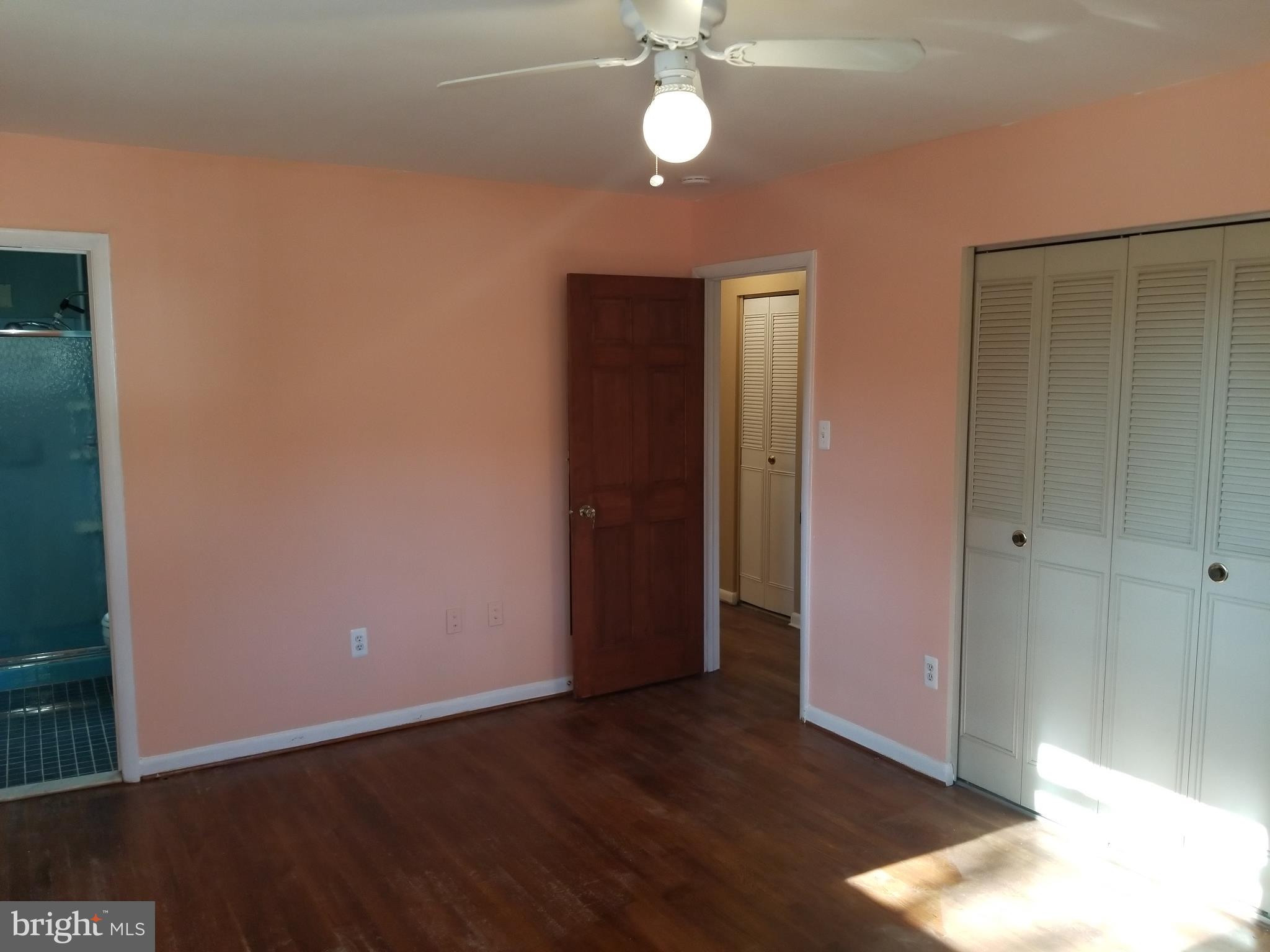 2708 Rambler Place Adelphi, MD 20783 - Photo 17 of 41 an empty room with wooden floor and closet