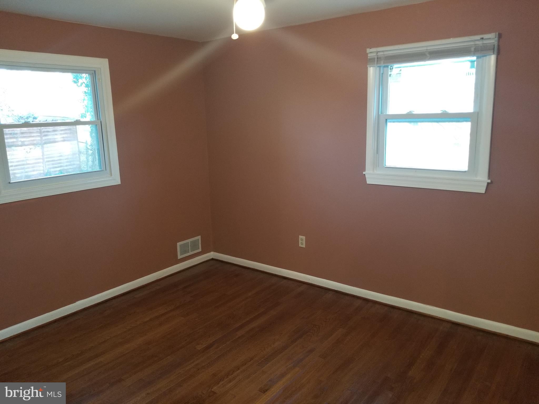 2708 Rambler Place Adelphi, MD 20783 - Photo 21 of 41 an empty room with wooden floor and windows