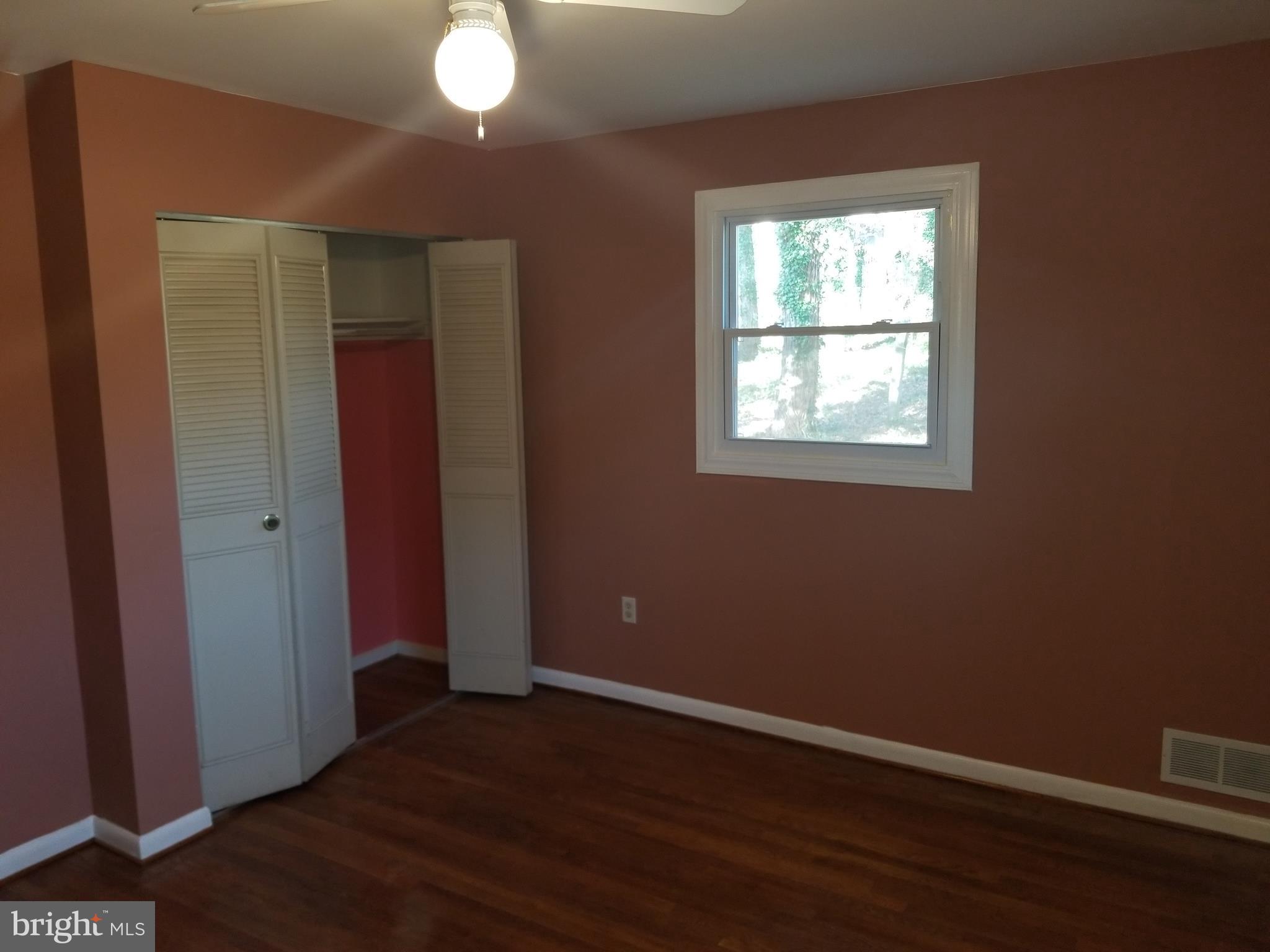 2708 Rambler Place Adelphi, MD 20783 - Photo 22 of 41 an empty room with wooden floor and windows
