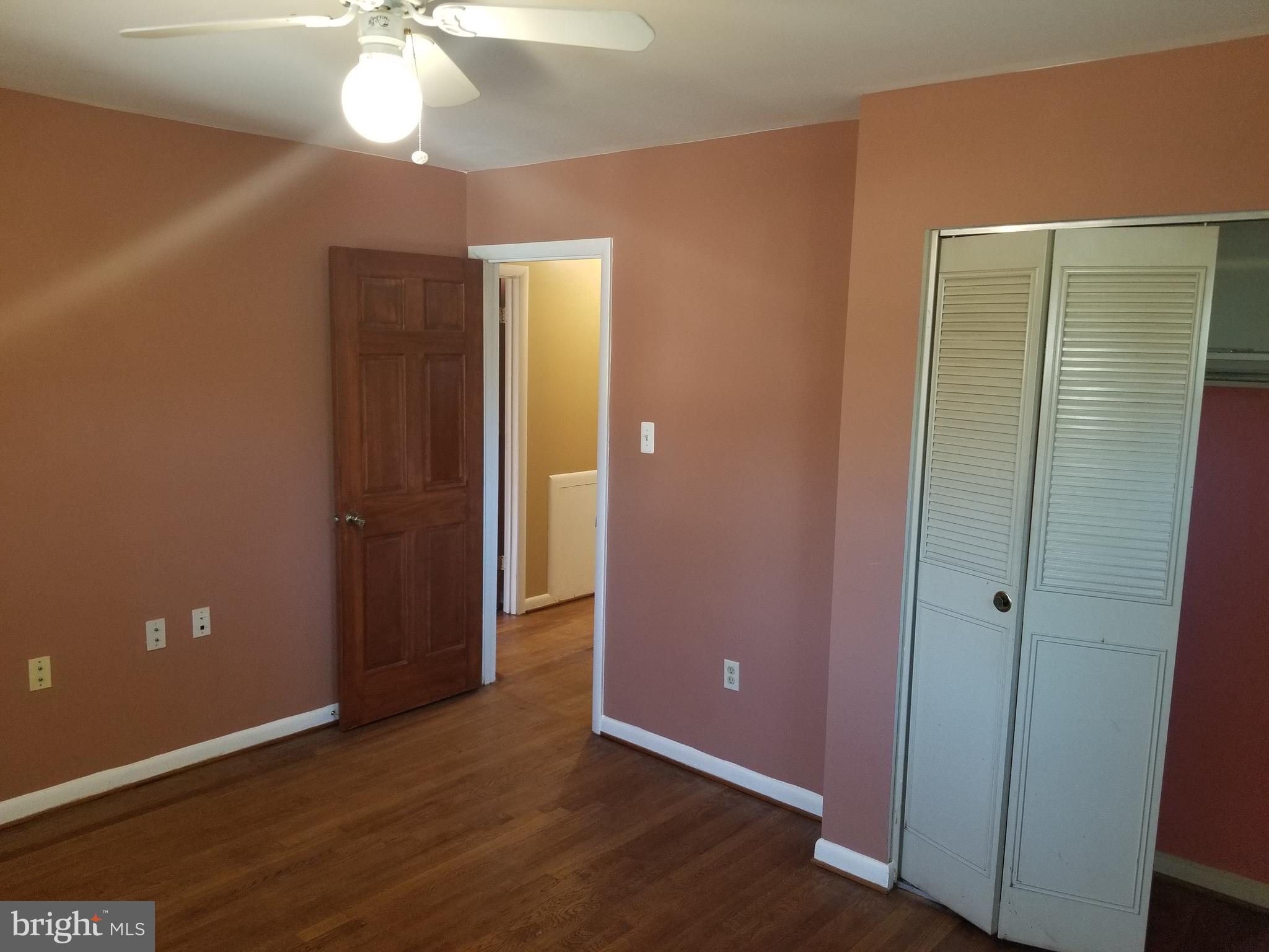 2708 Rambler Place Adelphi, MD 20783 - Photo 23 of 41 an empty room with wooden floor and chandelier fan