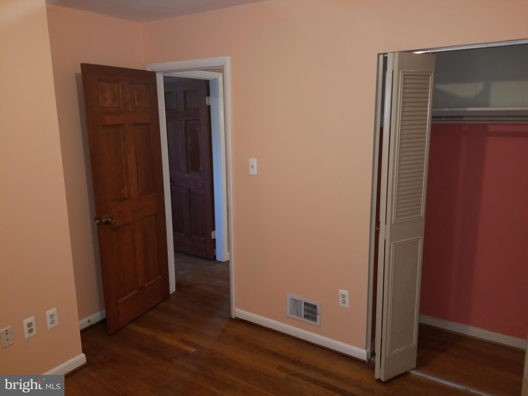 2708 Rambler Place Adelphi, MD 20783 - Photo 25 of 41 an empty room with wooden floor and closet
