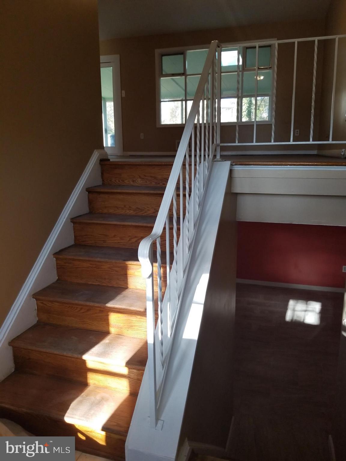 2708 Rambler Place Adelphi, MD 20783 - Photo 26 of 41 a view of staircase with lots of frames on wall and windows