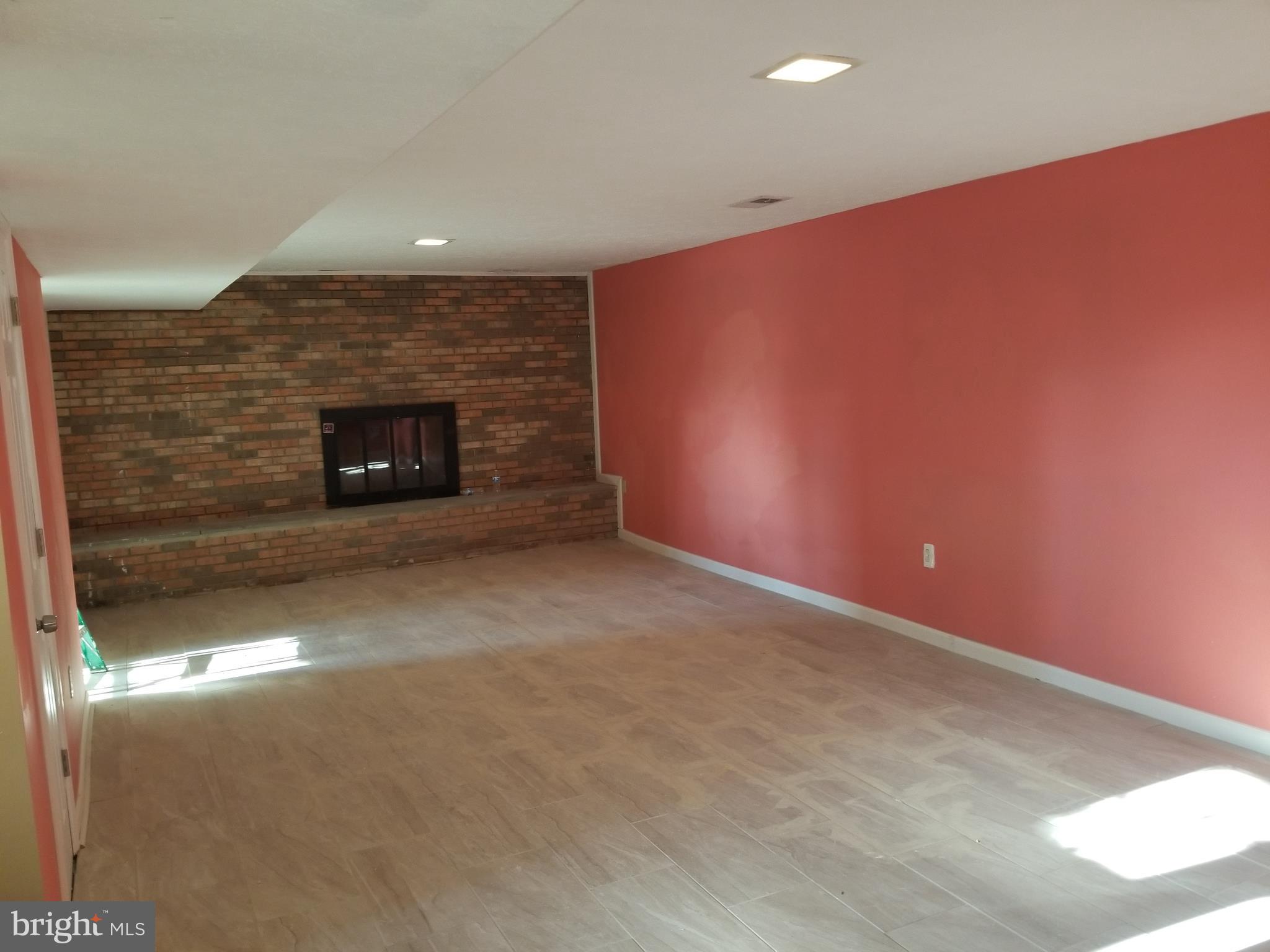 2708 Rambler Place Adelphi, MD 20783 - Photo 28 of 41 a view of an empty room with a fireplace