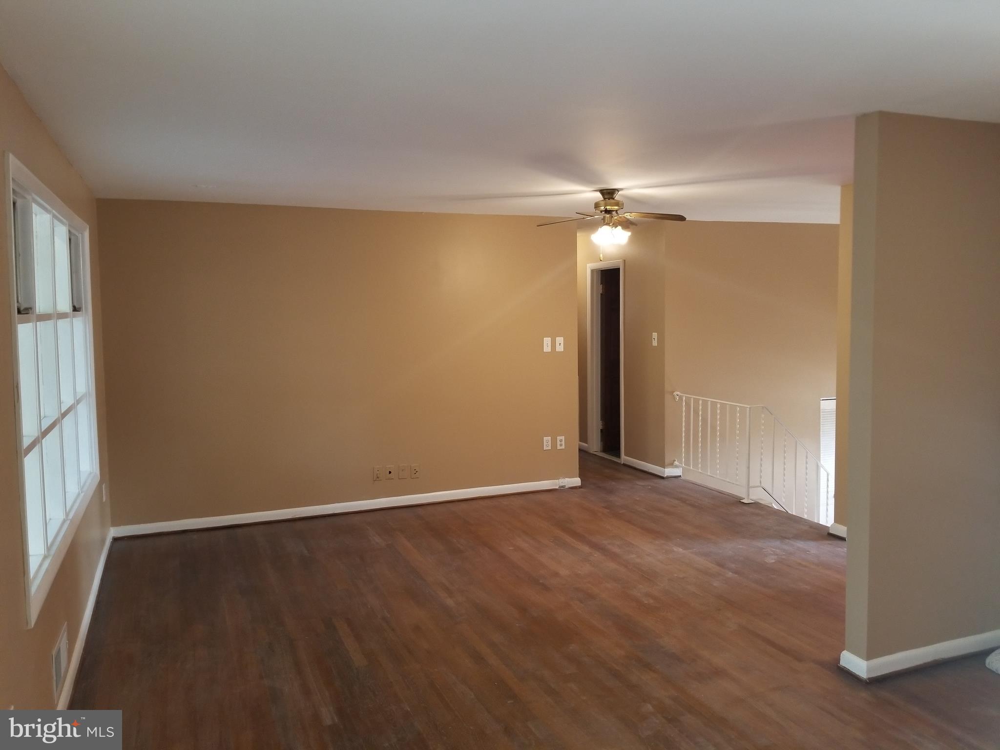 2708 Rambler Place Adelphi, MD 20783 - Photo 5 of 41 an empty room with a ceiling fan and a window