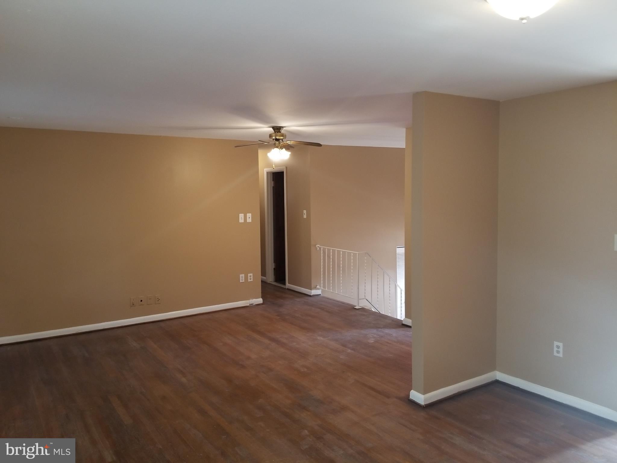 2708 Rambler Place Adelphi, MD 20783 - Photo 6 of 41 an empty room with wooden floor and chandelier fan