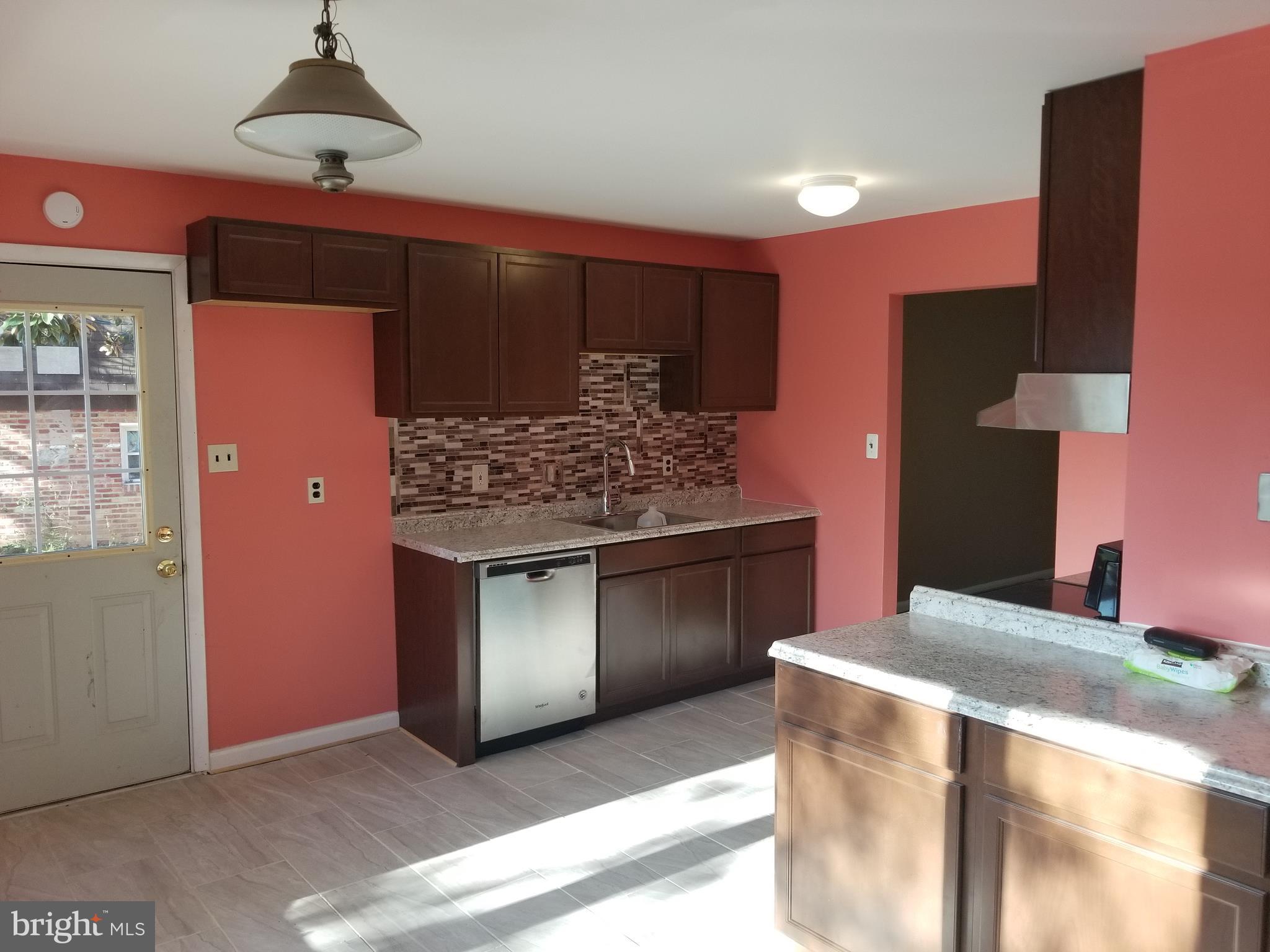2708 Rambler Place Adelphi, MD 20783 - Photo 8 of 41 a kitchen with stainless steel appliances granite countertop a stove and a refrigerator