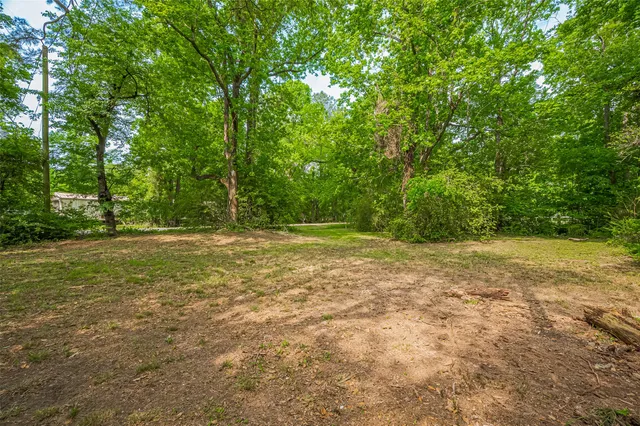 a view of outdoor space with deck and yard
