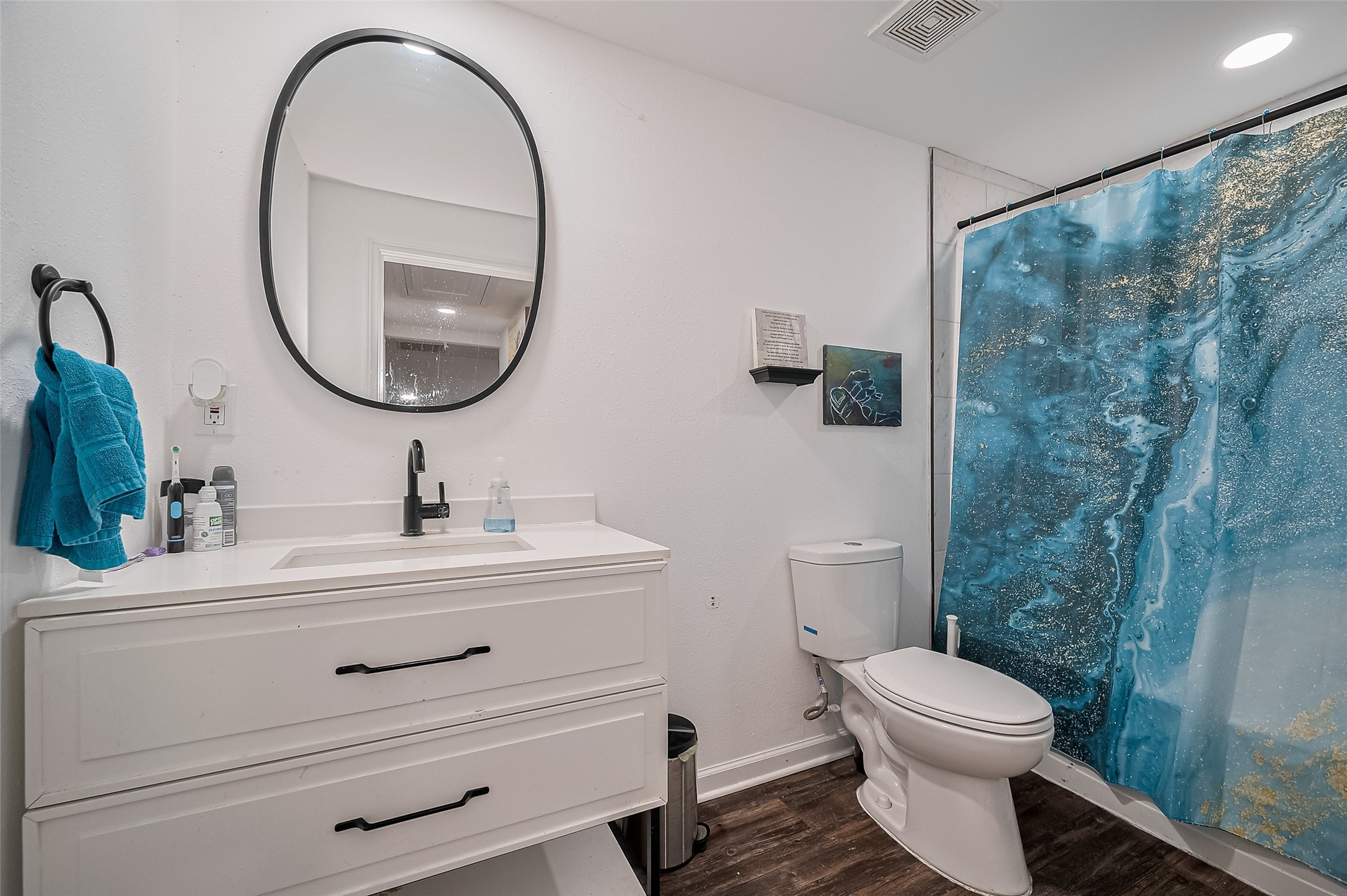 523 County Road 2073 Hull, TX 77564 - Photo 7 of 13 a bathroom with a sink mirror and toilet