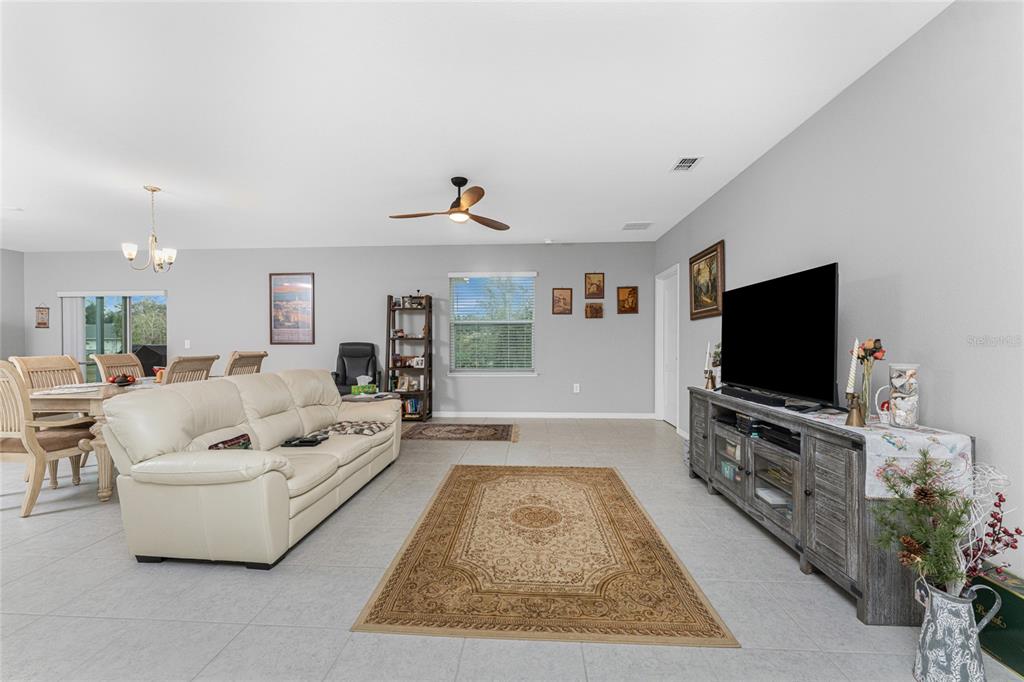 475 Posadas Circle Punta Gorda, FL 33983 - Photo 19 of 54 a living room with furniture and a flat screen tv