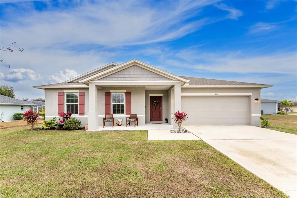 475 Posadas Circle Punta Gorda, FL 33983 - Photo 2 of 54 a front view of a house with swing and patio