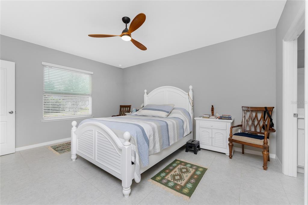 475 Posadas Circle Punta Gorda, FL 33983 - Photo 21 of 54 a spacious bedroom with a bed and a window