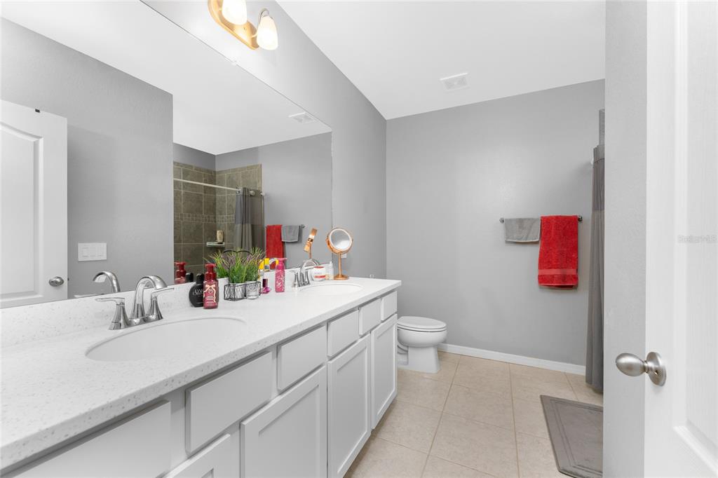 475 Posadas Circle Punta Gorda, FL 33983 - Photo 22 of 54 a bathroom with a sink vanity mirror and toilet